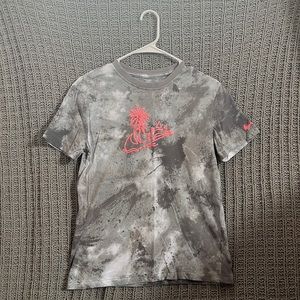 Size youth large grey nike t-shirt, with palm tree detailing on the front